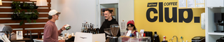 Eight Ounce Coffee Club Cafe photo with staff and a guest